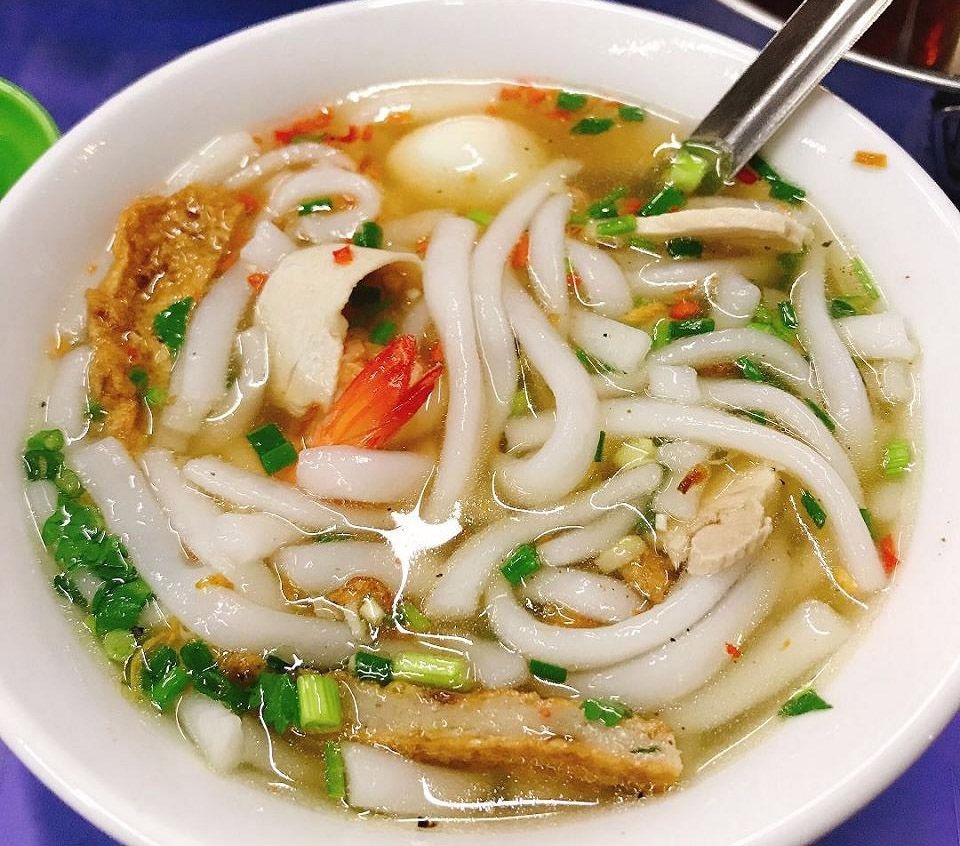 Thick tapioca noodles in rich broth with pork and fresh herbs 